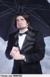 man-holding-umbrella-in-the-rain-and-sighing-adult-pixmac-image-88687400.jpg