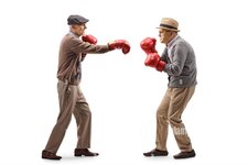 full-length-profile-shot-of-two-elderly-man-fighting-with-boxing-gloves-isolated-on-white-back...jpg